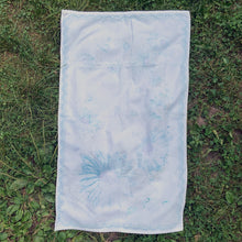 Load image into Gallery viewer, A vintage pale blue ultra soft cotton terry cloth bath towels featuring a striking spray of flowers in shades of turquoise, blue and green with an inset scalloped border pattern. Crafted by Besana, Italy. This gorgeous towel is sure to amplify your bath!  In excellent condition, free form tears/stains. Possibly new old stock.  Measures 47 inches x 27 1/2 inches
