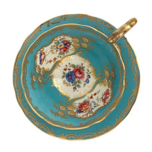 Load image into Gallery viewer, A rare vintage Bone China teacup and saucer with scalloped rim features a hand painted turquoise interior on a white ground, lavishly decorated with gold gilt filigree, complemented by colourful floral bouquets on the interior of the cup and saucer. Crafted by Aynsley, England. Backstamp indicates production between 1934 - 1950s. A stunning addition to your teacup collection!
