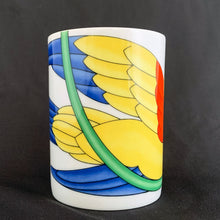 Load image into Gallery viewer, This bright and energetic &quot;Parrot-in-Ring&quot; white ceramic mug is so much fun. This cheeky grinned parrot is brightly coloured in orange, yellow, green and blue. Produced by Fitz &amp; Floyd, Japan, 1979.  In excellent vintage condition, free from chips/cracks. Marked on the bottom &quot;Parrot-in-Ring, Fitz &amp; Floyd Inc., ©MCMLXXIX, FF, 64&quot;  Measures 2 3/4 x 3 3/4 inches  Capacity 11 ounces
