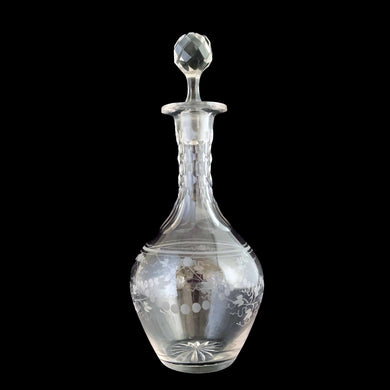 Add a touch of elegance to your tablescape with this antique vintage cut crystal decanter featuring strings of pearls and vines cut around the body with faceted neck and stopper. Bring a little sparkle to your home with this one-of-a-kind piece!

In good vintage condition, no chips, but there is a tiny flea nick on the stopper end.

Measures 3 3/8 x 9 inches