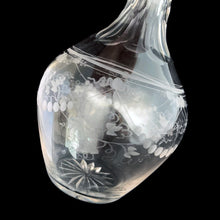 Load image into Gallery viewer, Add a touch of elegance to your tablescape with this antique vintage cut crystal decanter featuring strings of pearls and vines cut around the body with faceted neck and stopper. Bring a little sparkle to your home with this one-of-a-kind piece!

In good vintage condition, no chips, but there is a tiny flea nick on the stopper end.

Measures 3 3/8 x 9 inches
