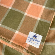Load image into Gallery viewer, Godfrey Hirst Pelage wool blanket in melon orange and green plaid, close-up on the label and blanket stitch edge
