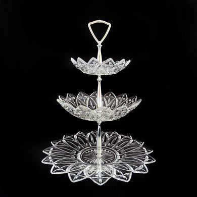 An outstanding and hard to find vintage three-tiered clear pressed glass 