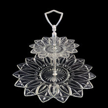Load image into Gallery viewer, An outstanding and hard to find vintage two-tiered Petal clear glass tidbit serving tray featuring a decorative silver toned metal stem plus D-shaped handle. Crafted by Federal Glass, USA, circa 1960s. This elegant serving piece will look stunning filled with treats on any dessert table. Perfect for weddings, showers, high tea and entertaining at home.

In excellent condition, no chips, minor wear to the metal stem.

Measures approximately 11 1/2 x 9 5/8 inches
