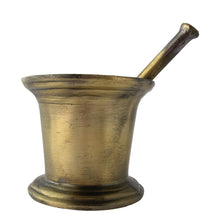 Load image into Gallery viewer, Vintage apothecary pharmacy chemist cast iron mortar and pestle faux painted to appear as brass. Salvaged from the estate of Dale&#39;s Pharmacy on Queen St. East in Toronto, Canada. Makes a great decor piece of prop for photography, TV and movies.  In as found vintage condition. Unmarked.  Mortar measures 4 1/2 x 3 3/4 inches and pestle 6 1/2 inches
