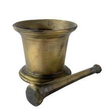 Load image into Gallery viewer, Vintage apothecary pharmacy chemist cast iron mortar and pestle faux painted to appear as brass. Salvaged from the estate of Dale&#39;s Pharmacy on Queen St. East in Toronto, Canada. Makes a great decor piece of prop for photography, TV and movies.  In as found vintage condition. Unmarked.  Mortar measures 4 1/2 x 3 3/4 inches and pestle 6 1/2 inches
