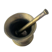 Load image into Gallery viewer, Vintage apothecary pharmacy chemist cast iron mortar and pestle faux painted to appear as brass. Salvaged from the estate of Dale&#39;s Pharmacy on Queen St. East in Toronto, Canada. Makes a great decor piece of prop for photography, TV and movies.  In as found vintage condition. Unmarked.  Mortar measures 4 1/2 x 3 3/4 inches and pestle 6 1/2 inches
