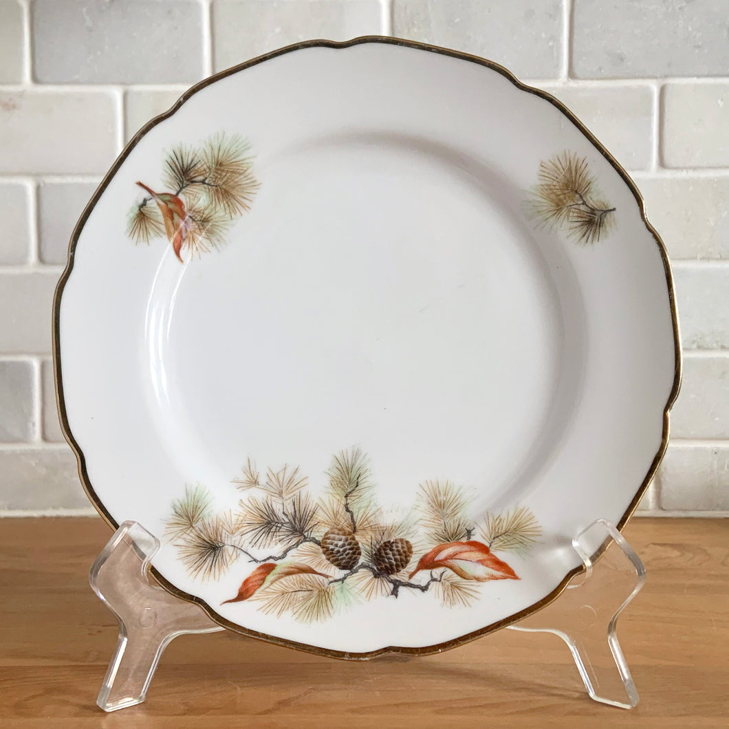 Charming vintage Pine Tree dinnerware tableware featuring pine boughs, cones and leaves in shades of green, orange and yellow with gold gilt trim. Craft by Fine Translucent China, Japan, 1960s. Eight Inch Salad Plate