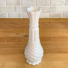 Load image into Gallery viewer, A very popular piece, this vintage milk glass bud vase has distinct pineapple shape with diamond and fluted details finished with a scalloped edge. Crafted by Anchor Hocking, USA, 1960s. Create a show stopping flower arrangement in this elegant white vase. A perfect addition to your cottage, farmhouse or wedding decor.

In excellent condition, no chips.

Measures 9 inches
