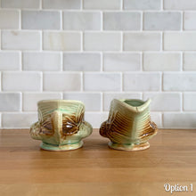 Load image into Gallery viewer, Striking vintage gloss glazed Pinecone sugar and creamer in shades of green and brown. Crafted by McCoy Pottery, 1946. Complete your tea set with this rare set, a must for any McCoy art pottery collector. Makes a nice complement to your Christmas, cottage or lodge decor!

Option 1: Creamer measures 5 5/8 x 3 1/4 x 2 7/8 inches. Sugar measures 5 1/2 x 3 3/8 x 2 3/4 inches. In excellent condition, no chips/cracks/repairs, age-related crazing. Maker&#39;s mark.
