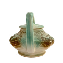 Load image into Gallery viewer, Striking vintage matted glazed Pinecone teapot in shades of green and brown. Crafted by McCoy Pottery, 1946. This rare teapot is must for any McCoy art pottery collector and a nice complement to your Christmas, cottage or lodge decor!

In good vintage condition, chip at spout, no crazing/cracks/repairs, Maker&#39;s mark on the bottom.

Measures 9 3/4 x 6 1/4 x 6 1/4 inches
