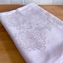 Load image into Gallery viewer, Add a touch of elegance to any table setting with this vintage pink-on-pink damask Belgian linen tablecloth, showcasing a charming pattern of Chrysanthemum flowers. Free from stains/tears. Measures 66 x 51 inches
