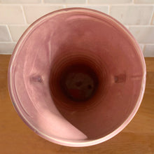 Load image into Gallery viewer, Vintage gloss pink art deco trumpet vase with ribbed design and&nbsp;strap handles. Crafted by Brush McCoy Pottery, 1940s. This rare vase must for any art pottery collector!

In excellent vintage condition, no chips/cracks/repairs. Marked on the bottom, Brush&nbsp; USA 579 8.

Measures 5 5/8 x 8 1/4 inches
