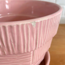 Load image into Gallery viewer, Highly collectible vintage mid-century pink basketweave ceramic planter with attached underplate. Crafted by McCoy Pottery, 1950s. The perfect home for your favourite houseplant or succulent and a must-have for any art pottery collector!

In excellent vintage condition, no chips/cracks/repairs, age-related crazing. Maker&#39;s mark.

Measures 6 1/2 x 5 5/8 inches
