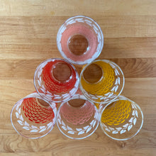 Load image into Gallery viewer, Glassware dreams are made of these beauties! This is a fantastic set of six vintage mid-century beverage glasses decorated in pairs with a pink, yellow or red basketweave pattern topped with a band of white ivy. Produced by Federal Glass, circa 1950s. The perfect addition to any style vintage kitchen and your tablescape will thank you!   In like new condition, free from chips/wear. The paint is vibrant and shiny. Unmarked.  Measures 2 1/2 x 4 1/2 inches  Capacity 12 ounces
