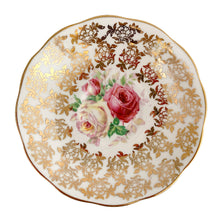 Load image into Gallery viewer, Traditional vintage mid-century era Avon shaped teacup and saucer featuring hand painted pink cabbage roses and heavy gold filigree pattern of flowers on the cup and saucer interiors with gently scalloped gold gilt rims. Crafted by Royal Albert, England, circa 1950s. A beautiful gift or addition to your collection!
