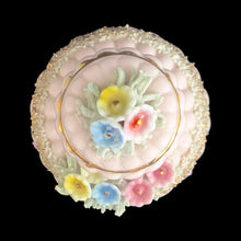 Load image into Gallery viewer, Vintage mid-century pink double pointed ceramic vanity perfume bottle featuring figural flowers and gold spaghetti. Made in Japan. As pretty addition to any bath or bedroom vanity!

In excellent condition, no chips. Marked Japan.

Measures 3 1/4 x 5 1/2
