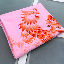 Load image into Gallery viewer, We are suckers for gorgeous linens and this piece does not disappoint! This strikingly unique vintage Barbie pink linen tablecloth features a printed pattern of roses and Chinoiserie river scenes and pagodas in shades of orange, brown and ochre . A conversation piece for your table!~  This piece is new old stock and does not appear to have been used to laundered and is in excellent condition.  Measures 52 x 85 inches   

