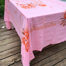 Load image into Gallery viewer, We are suckers for gorgeous linens and this piece does not disappoint! This strikingly unique vintage Barbie pink linen tablecloth features a printed pattern of roses and Chinoiserie river scenes and pagodas in shades of orange, brown and ochre . A conversation piece for your table!~  This piece is new old stock and does not appear to have been used to laundered and is in excellent condition.  Measures 52 x 85 inches   
