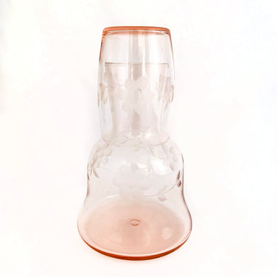 Elegant and feminine perfectly describe this pink depression glass bedside tumble-up, water carafe decanter with etched floral design. A lovely piece to place by your bedside or in a guest room!  In excellent condition, no chips or cracks.  Overall measures 3 7/8 x 6 3/4 inches  Carafe measures 3 7/8 x 5 3/4 inches Glass measures 2 1/4 x 3 1/8 inches