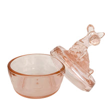 Load image into Gallery viewer, Vintage Jeannette Glass pink depression glass powder jar, open view, lid leaning against the open base at an angle showing the hollow interior of the rounded base and the underside of the flat lid with seated Scottie dog finial
