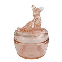 Load image into Gallery viewer, Vintage Jeannette Glass pink depression glass powder jar with lid, rear view, showing the Scottie dog finial facing away with tail detail visible, textured fur moulding, flat lid, rounded base in blush pink glass
