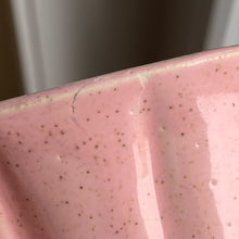 Load image into Gallery viewer, Vintage pink art pottery planter pot featuring a ribbed design and attached underplate. Crafted by McCoy Pottery, USA, circa 1940s. A collectible art pottery planter is perfect for a tiny houseplant, succulents or as part of your McCoy collection!  In vintage condition, several chips a crack. See photos for details.  Measures 4 1/8 x 3 1/2 inches
