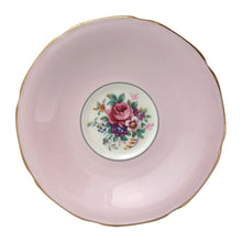 Load image into Gallery viewer, Stunning vintage teacup and saucer decorated with a pale shell pink interior features a bouquet of colourful flowers on the cup's exterior and centre of saucer, gold gilt scalloped rim. Crafted by The Paragon China Company, England, circa 1950s. A beautiful addition to your teacup and tableware collection!
