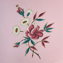 Load image into Gallery viewer, Close-up of hand-painted toleware rose bouquet on vintage pink metal laundry hamper
