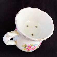 Load image into Gallery viewer, Vintage white porcelain mustache cup glazed in a deep coral with gold gilt flowers and rim featuring a sweet gold flower on the handle. Use as intended or repurpose as a toothbrush or make-up brush holder.  Made in Germany.  In excellent condition, no chips/cracks/repairs. Some wear to the gold.  Dimensions: 4&quot; x 3-5/8&quot;
