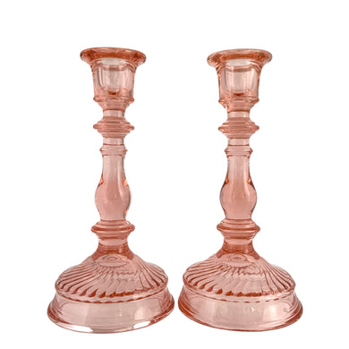 Beautifully detailed pair of twisted optic pink depression glass candlesticks. Crafted by Imperial Glass-Ohio, USA, between 1927 - 1930. A stunning piece of history to grace your table and provide ambience to your gathering.  In excellent condition, free from chips.  Measures 4 x 8 1/4 inches