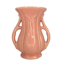 Load image into Gallery viewer, Beautiful vintage gloss pink ribbed trumpet vase with handles and embossed tassel. Crafted by McCoy Pottery, 1940s. This vase is must for any art pottery collector!

In excellent vintage condition, no chips/cracks/repairs, with age-related crazing. Maker&#39;s mark on the bottom.

Measures 6 x 4 3/8 x 8 1/4 inches
