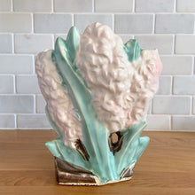 Load image into Gallery viewer, Rare vintage mid-century matte pink Hyacinth vase. Crafted by McCoy Pottery, USA, 1950. This special piece is must for any art pottery collector!

In as found vintage condition, two chips on the leaf tips, no cracks/repairs. Maker's mark.

Measures 6 1/2 x 4 x 8 inches
