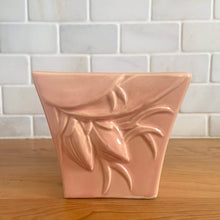 Load image into Gallery viewer, Vintage gloss pink glazed lily bud jardiniere planter No. 39. Crafted by McCoy Pottery, USA, 1948. This collectible planter is the perfect for succulents or decorative display and makes a lovely gift for an art pottery collector.

In excellent vintage condition, no chips, cracks or repairs, manufacturer's glaze pops. Makers mark.

Measures 4 5/8 x 4 1/8 x 4 inches
