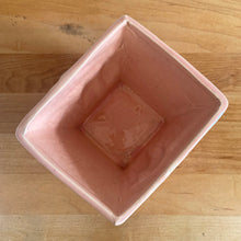 Load image into Gallery viewer, Vintage gloss pink glazed lily bud jardiniere planter No. 39. Crafted by McCoy Pottery, USA, 1948. This collectible planter is the perfect for succulents or decorative display and makes a lovely gift for an art pottery collector.

In excellent vintage condition, no chips, cracks or repairs, manufacturer's glaze pops. Makers mark.

Measures 4 5/8 x 4 1/8 x 4 inches
