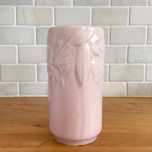 Load image into Gallery viewer, Vintage Art Deco matte pink Butterfly Line cylinder vase. Crafted by Nelson McCoy Pottery, early 1940s. This rare piece is must for any art pottery collector! A lovely way to enhance your home&#39;s decor or give as a gift!

In excellent vintage condition, no chips/cracks/repairs. Typical age-related crazing, manufacturer&#39;s glaze pops. Maker&#39;s marks.

Measures 3 x 6 inches
