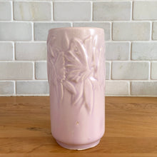 Load image into Gallery viewer, Vintage Art Deco matte pink Butterfly Line cylinder vase. Crafted by Nelson McCoy Pottery, early 1940s. This rare piece is must for any art pottery collector! A lovely way to enhance your home&#39;s decor or give as a gift!

In excellent vintage condition, no chips/cracks/repairs. Typical age-related crazing, manufacturer&#39;s glaze pops. Maker&#39;s marks.

Measures 3 x 6 inches
