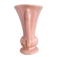Load image into Gallery viewer, Beautiful vintage matte pink classically shaped handled trumpet vase. Crafted by McCoy Pottery, 1940s. This vase is must for any art pottery collector!

In as found vintage condition, no chips or repairs, tight hairline crack. Maker&#39;s mark on the bottom.

Measures 6 1/4 x 9 1/4 inches
