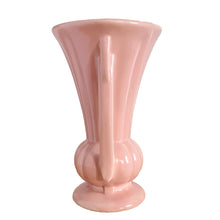 Load image into Gallery viewer, Beautiful vintage matte pink classically shaped handled trumpet vase. Crafted by McCoy Pottery, 1940s. This vase is must for any art pottery collector!

In as found vintage condition, no chips or repairs, tight hairline crack. Maker&#39;s mark on the bottom.

Measures 6 1/4 x 9 1/4 inches
