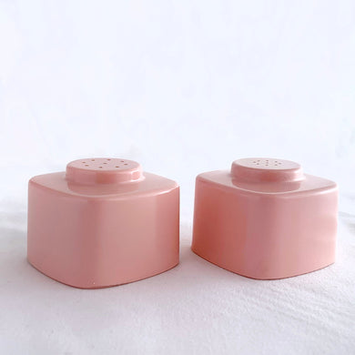 A fabulous retro pair of vintage pink melamine square salt and pepper shakers. Designed by Joan Luntz for the International Molding Company who made the mid-century modern Brookpark melamine, circa 1950.  In excellent condition, free from chips/cracks with original stoppers (pepper stopper is discoloured from use).  Measures 1-7/8