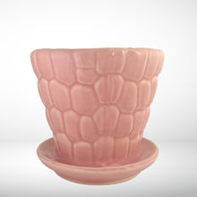 Load image into Gallery viewer, Striking vintage gloss pink pebble planter pot with attached saucer. Crafted by McCoy Pottery, 1950s. This planter is must for any McCoy art pottery collector!

In excellent vintage condition, no chips or cracks, crazing present. Marked 303 and 6 on the bottom.

Measures 6 1/4 x 5 1/2 inches
