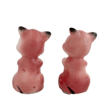 Load image into Gallery viewer, Pair of vintage mid-century era hand painted pink pig ceramic figurines. Made in Japan. An adorable addition to any kitsch decor collection!

In as found vintage condition. One pig has a chip on ear tip.

Measures 2 1/2 inches tall
