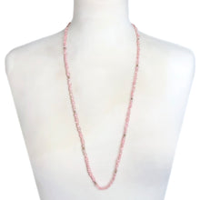 Load image into Gallery viewer, A dreamy vintage unknotted strand of delicate blush pink nested freshwater pearls, uniquely shaped in an organic baroque rice form with tiny gold beads sprinkled throughout with a pair of matching earrings with gold findings.
In excellent condition.
Measures 30 inches (opera length)/ Earrings approximately 1 x 1 inch
