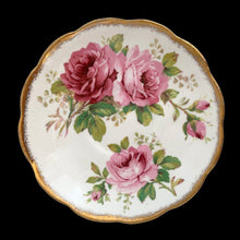 Load image into Gallery viewer, This vintage American Beauty bone china teacup and saucer is so pretty! Both the Countess shaped cup and saucer have a lovely scalloped edge with hand painted roses in shades of pink and green with gold gilt rim. Crafted by Royal Albert, England, 1941 to 1998. A lovely addition to your teacup collection or to give as a gift!

In excellent condition, free from chips, cracks and repairs. Makers marks present.

Teacup measures 3 1/4 x 2 3/4 inches. Saucer measures 5 1/2 inches
