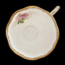 Load image into Gallery viewer, This vintage American Beauty bone china teacup and saucer is so pretty! Both the Countess shaped cup and saucer have a lovely scalloped edge with hand painted roses in shades of pink and green with gold gilt rim. Crafted by Royal Albert, England, 1941 to 1998. A lovely addition to your teacup collection or to give as a gift!

In excellent condition, free from chips, cracks and repairs. Makers marks present.

Teacup measures 3 1/4 x 2 3/4 inches. Saucer measures 5 1/2 inches
