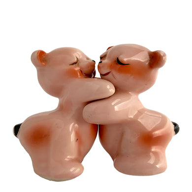 Vintage hand painted pink Snuggle Hugs hugging bears salt and pepper shakers. Designed by Ruth Van Tellinger, USA, 1940s. Add these adorable kitschy shakers to your collection!

In excellent condition, no chips/cracks/repairs. Impressed maker's mark.

Measures 2 3/8 x 2 3/4 x 3 3/8 inches