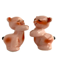 Load image into Gallery viewer, Vintage hand painted pink Snuggle Hugs hugging bears salt and pepper shakers. Designed by Ruth Van Tellinger, USA, 1940s. Add these adorable kitschy shakers to your collection!

In excellent condition, no chips/cracks/repairs. Impressed maker&#39;s mark.

Measures 2 3/8 x 2 3/4 x 3 3/8 inches
