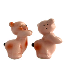 Load image into Gallery viewer, Vintage hand painted pink Snuggle Hugs hugging bears salt and pepper shakers. Designed by Ruth Van Tellinger, USA, 1940s. Add these adorable kitschy shakers to your collection!

In excellent condition, no chips/cracks/repairs. Impressed maker&#39;s mark.

Measures 2 3/8 x 2 3/4 x 3 3/8 inches
