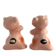 Load image into Gallery viewer, Vintage hand painted pink Snuggle Hugs hugging bears salt and pepper shakers. Designed by Ruth Van Tellinger, USA, 1940s. Add these adorable kitschy shakers to your collection!

In excellent condition, no chips/cracks/repairs. Impressed maker&#39;s mark.

Measures 2 3/8 x 2 3/4 x 3 3/8 inches
