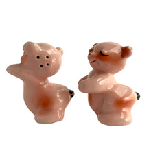 Load image into Gallery viewer, Vintage hand painted pink Snuggle Hugs hugging bears salt and pepper shakers. Designed by Ruth Van Tellinger, USA, 1940s. Add these adorable kitschy shakers to your collection!

In excellent condition, no chips/cracks/repairs. Impressed maker&#39;s mark.

Measures 2 3/8 x 2 3/4 x 3 3/8 inches
